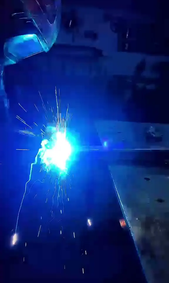Welding in the workshop, and finished cages and rings at customers' gyms